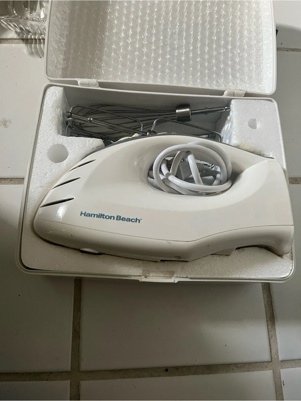 Handheld Hamilton Beach hand mixer in plastic hard case New